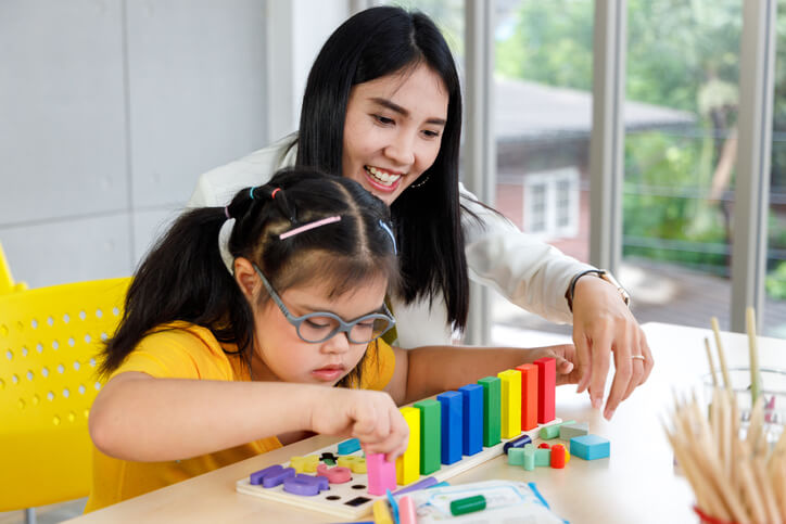 Teacher and Special Education Student Working Together