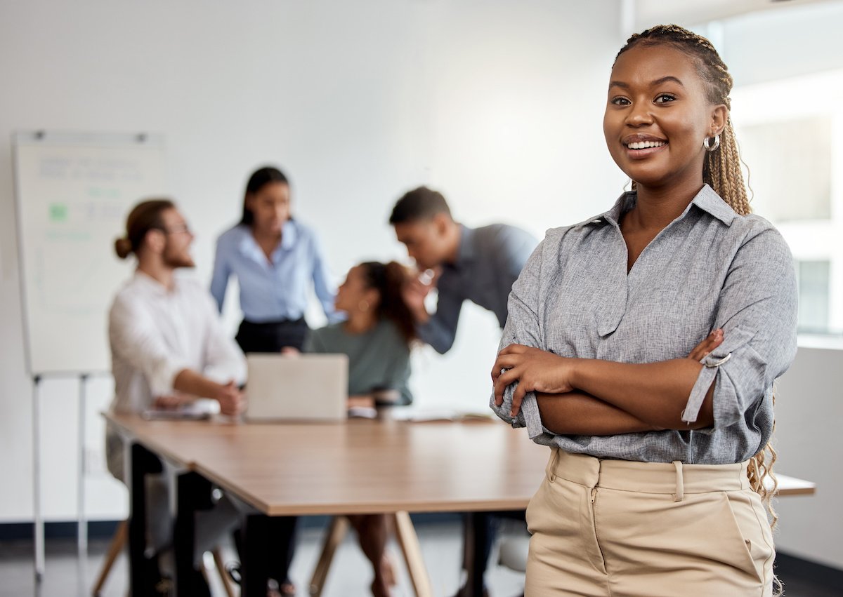 Portrait, leadership and arms crossed with a business black woman in the office for a strategy meeting.