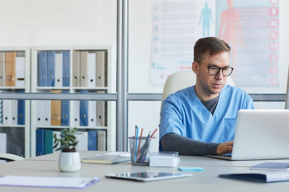 adult-student-on-laptop-studying-for-healthcare-administration-degree