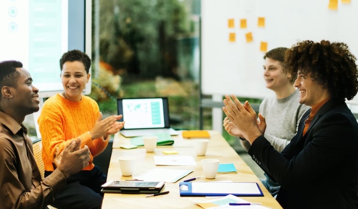 group of positive colleagues at work in the office