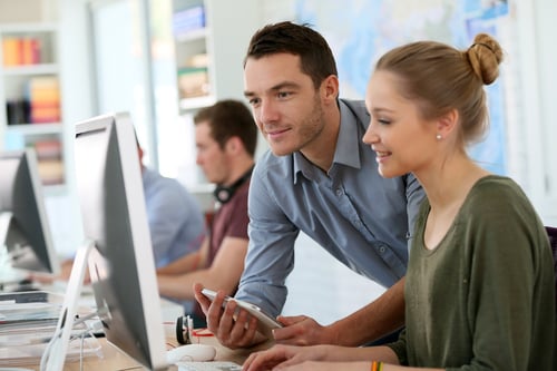 Student girl with trainer working on computer and tablet