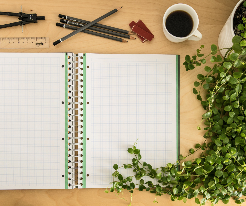 blank notebook and pens on a table