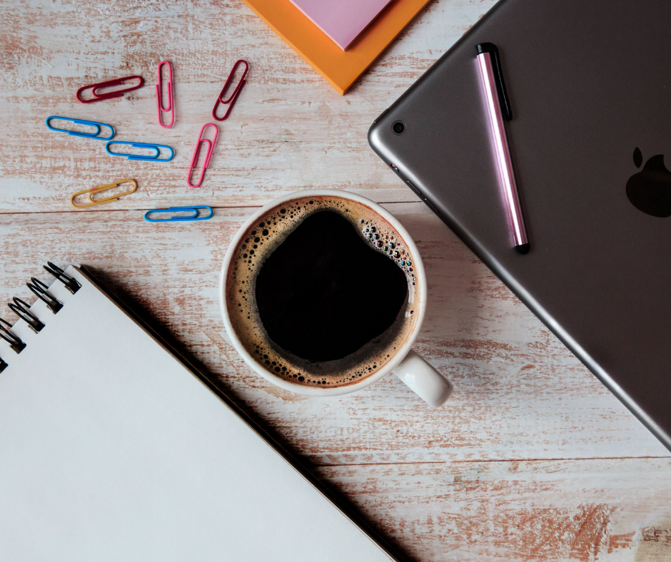 notepad, tablet, mug and paperclips