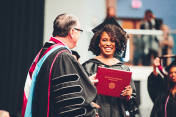 MBA grad receiving diploma