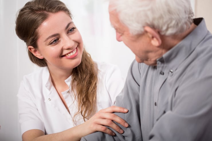 Woman Helping Senior Man