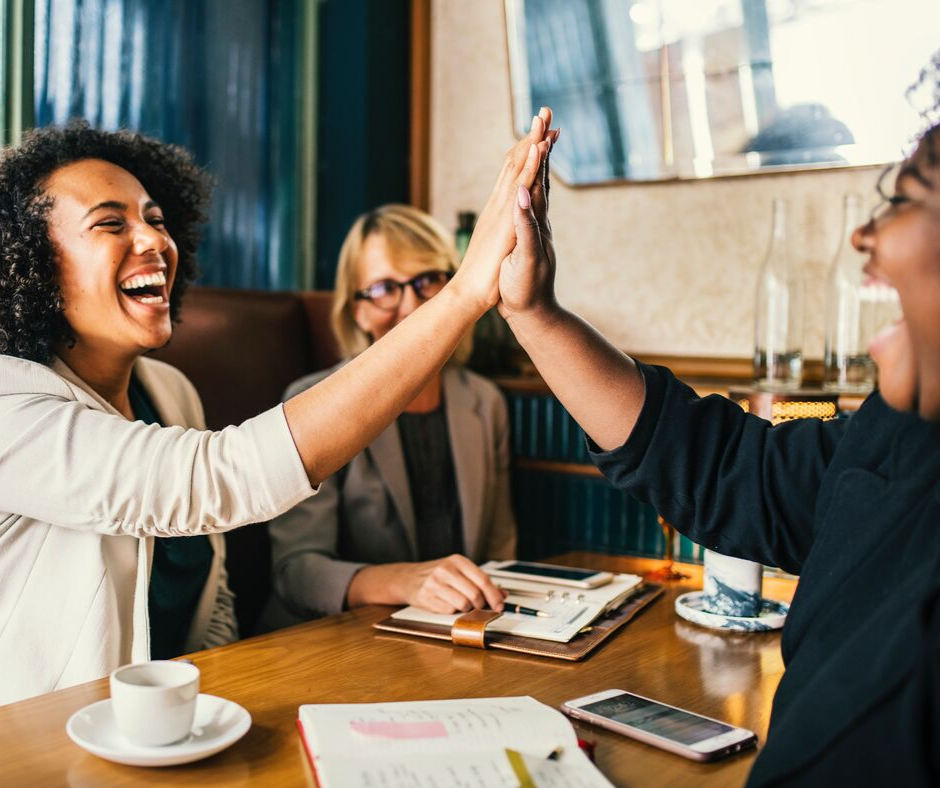 two people giving a high five